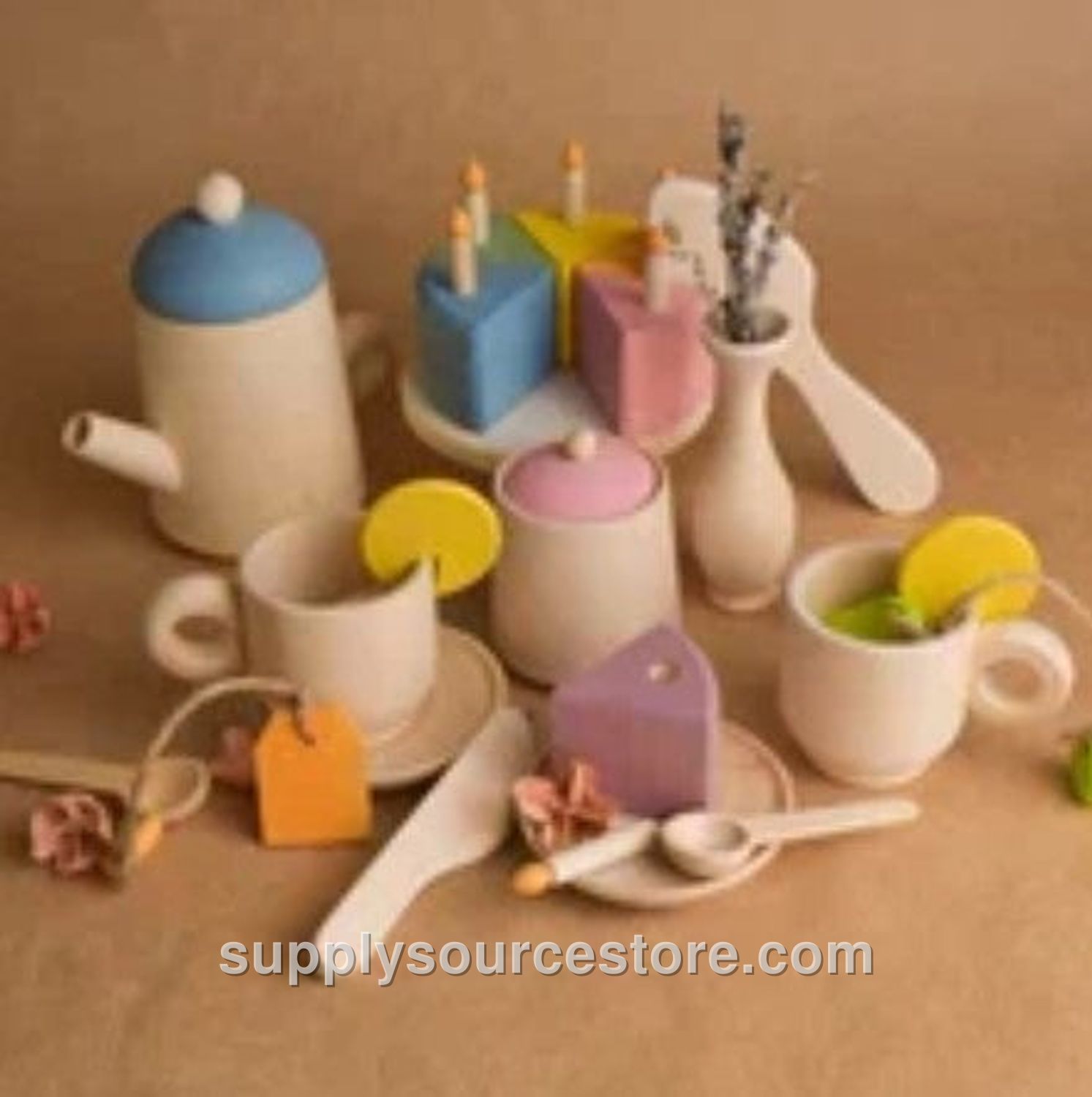 Tea Set and Pastel Cake with Candles