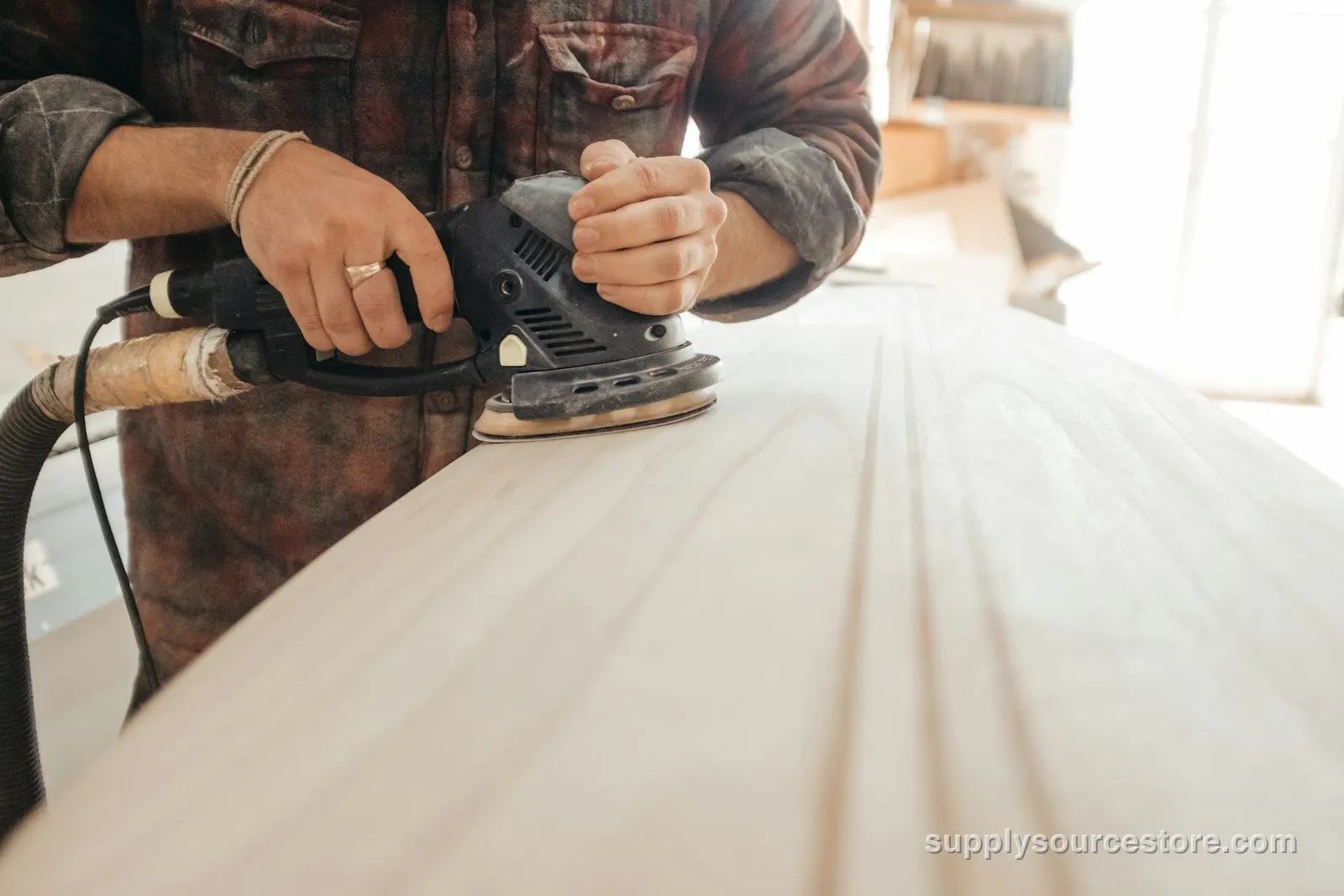 Sanding a wooden surface before finishing