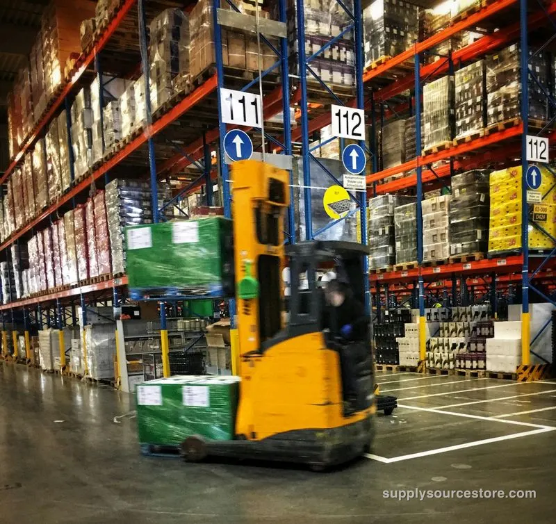 Forklift moving pallets in a warehouse