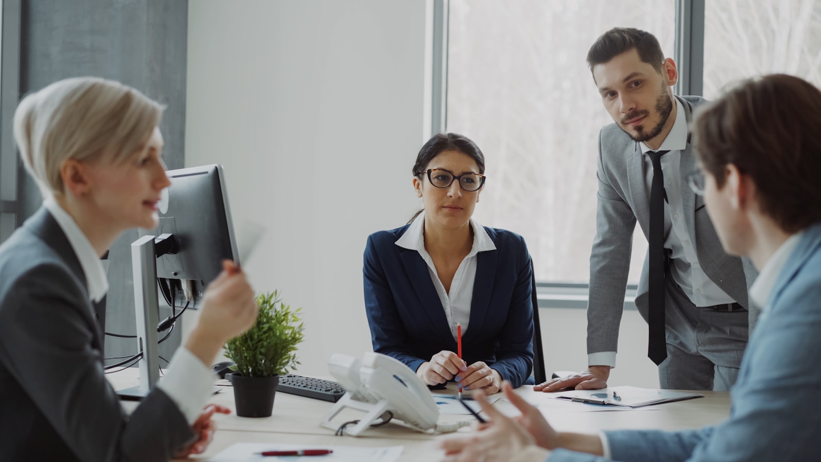 The Supply team in an office meeting